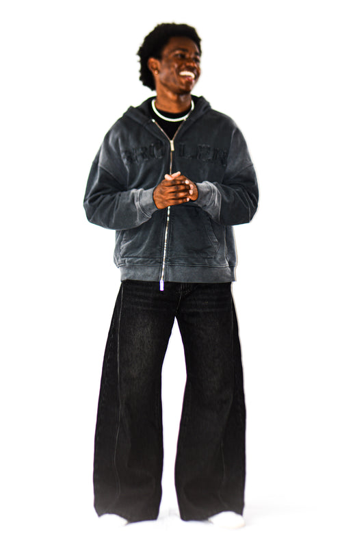 Model wearing men's Black Light Grey Wash baggy barrel jeans