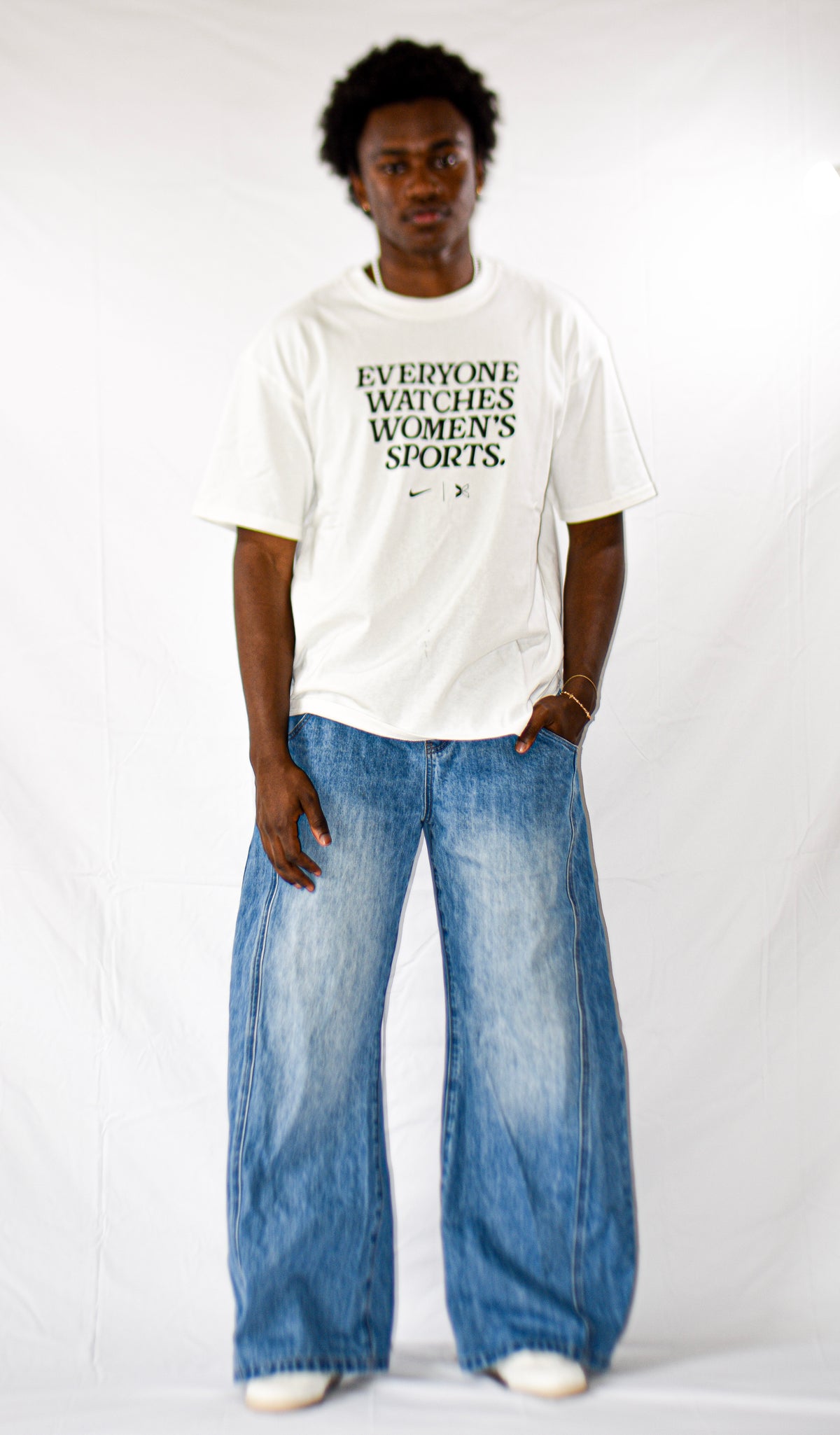 Model wearing men's Light Blue Wash baggy barrel jeans