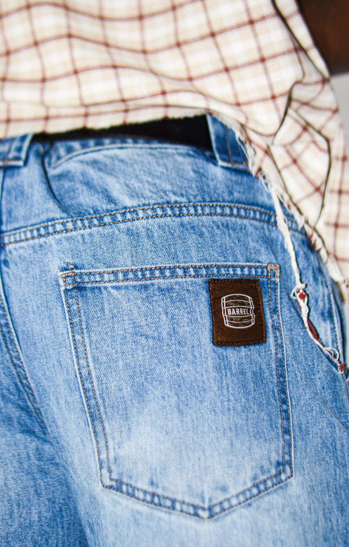 Light Blue Wash barrel jeans back pocket and Barrel logo detail